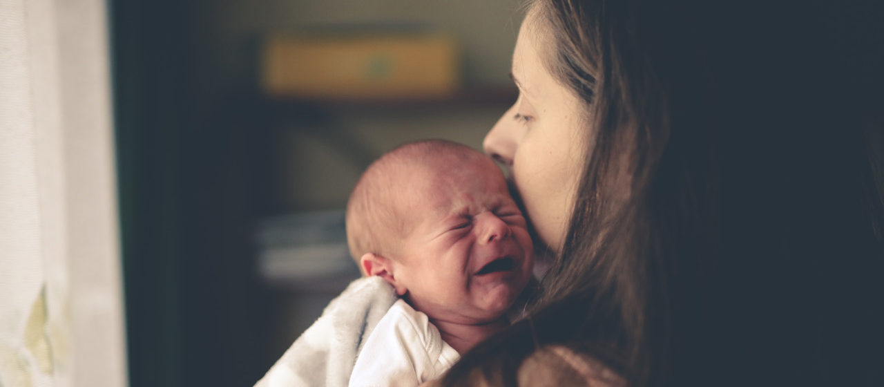 newborn baby crying sad