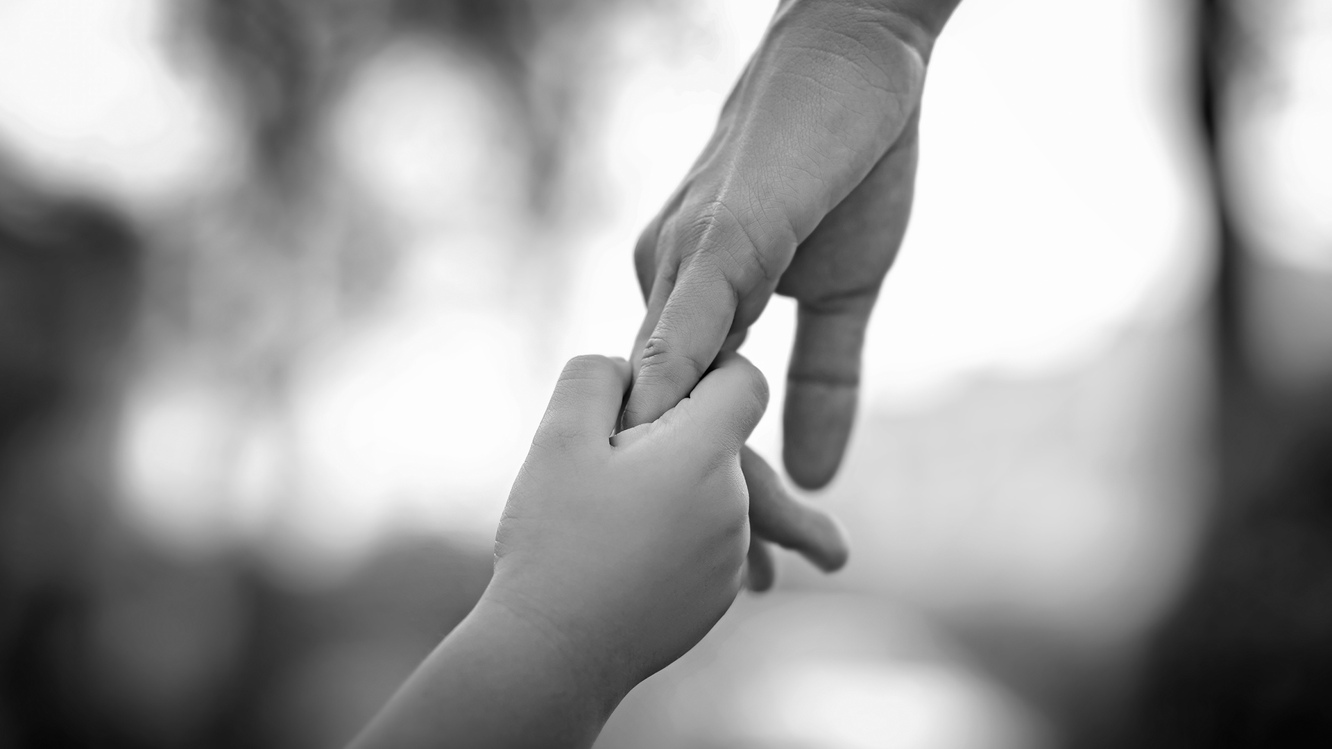 mom and child holding hands