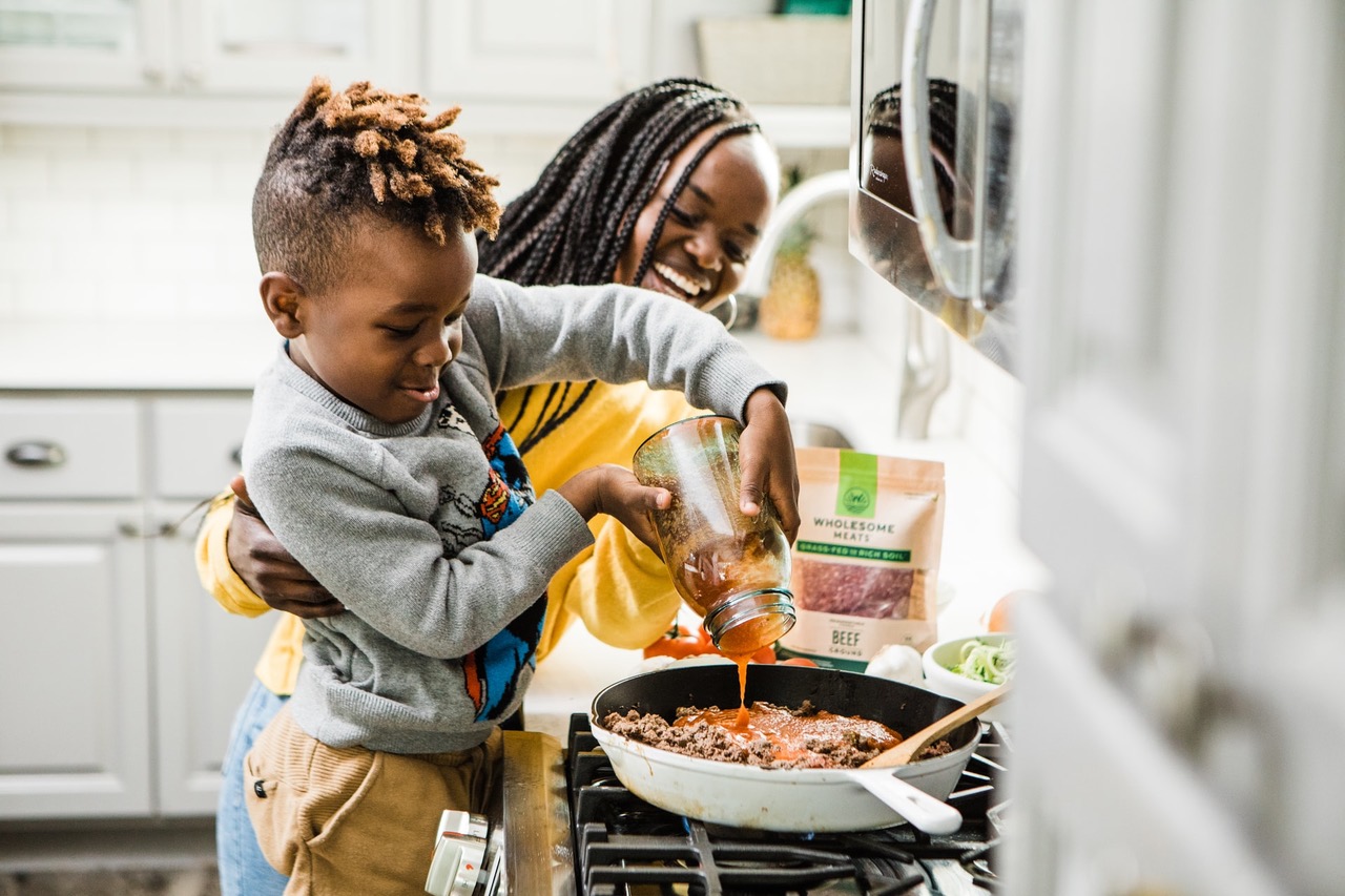 single mom and son cooking